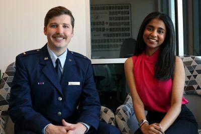 Monica Shanmugan and Patrick Corrigan seated.